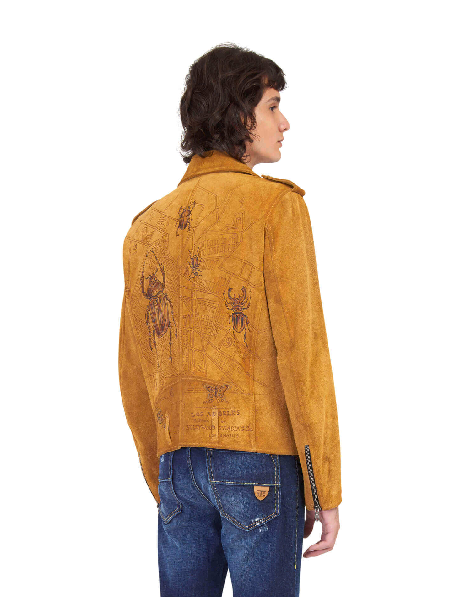 DUSTIN SUEDE L.A. JACKET Cognac suede jacket, asymmetrical zip closure. Three frontal pockets. Zipped sleeves. Hand-painted details on the back. Made in Italy. HTC LOS ANGELES
