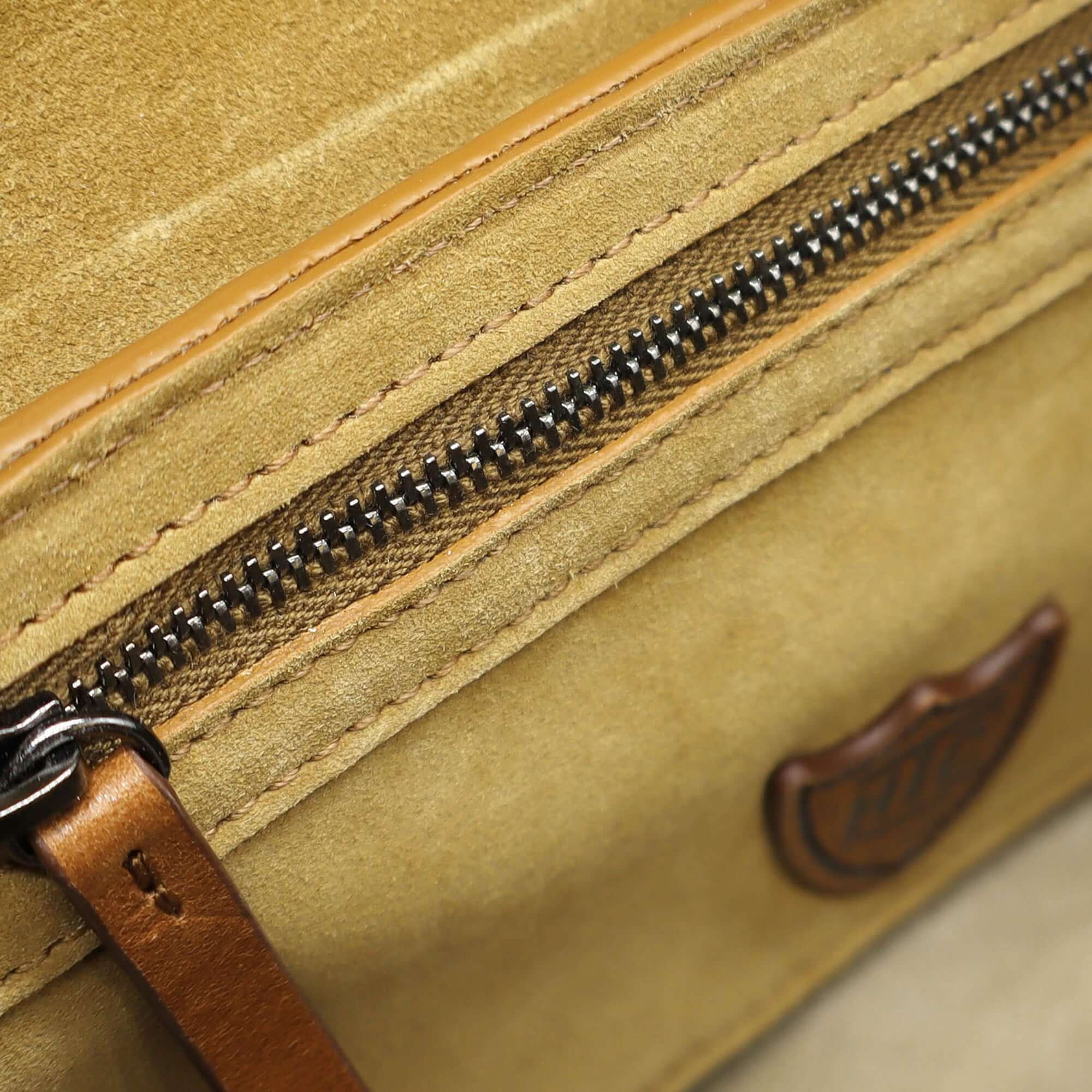 htc los angeles DOLLY SUEDE FLOWERS Baguette bag in Camel, featuring a button magnetic closure and flower-studded details. Crafted in Italy, 100% cow leather. Hollywood Trading Company