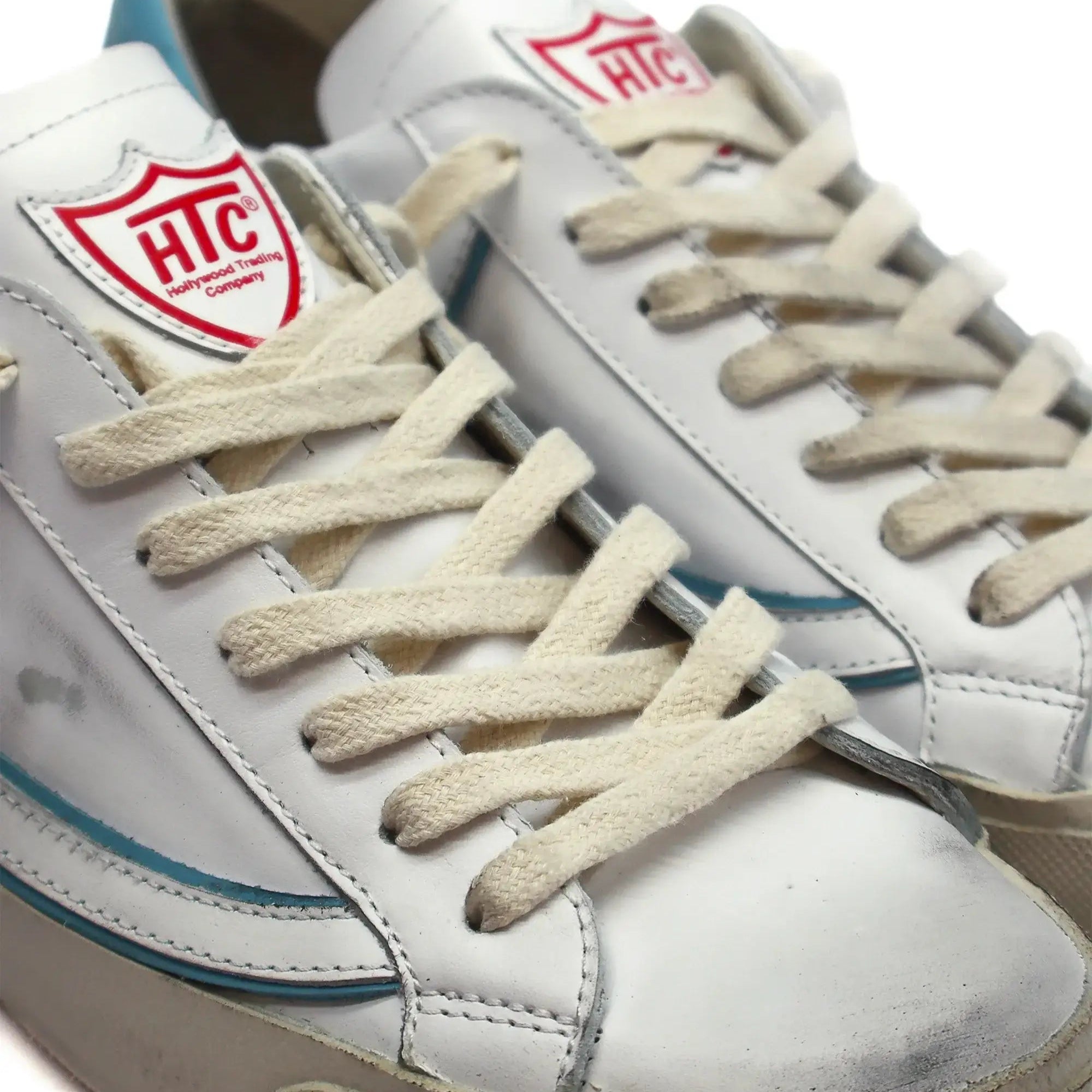 htc los angeles HTC VIPERS LOW MAN WHITE/AZURE HTC VIPERS LOW MAN W/A HTC VIPERS low-top sneakers in white/azure with a distressed finish. Standard fit, providing a comfortable and flexible wrap. Front lace-up closure for a secure fit. Small logo on the t