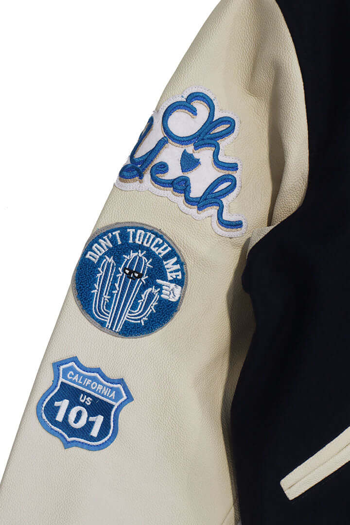 HTC LOS ANGELES HTC VARSITY JACKET NAVY HTC VARSITY JACKET NAVY Limited edition for Seoul. Varsity wool & leather bomber jacket. Front button closure, ribbed collar, cuffs and hem. Embroidered details and patches. Two side pockets. Main body composition: