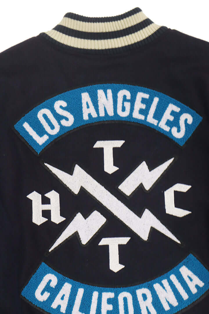 HTC LOS ANGELES HTC VARSITY JACKET NAVY HTC VARSITY JACKET NAVY Limited edition for Seoul. Varsity wool & leather bomber jacket. Front button closure, ribbed collar, cuffs and hem. Embroidered details and patches. Two side pockets. Main body composition: