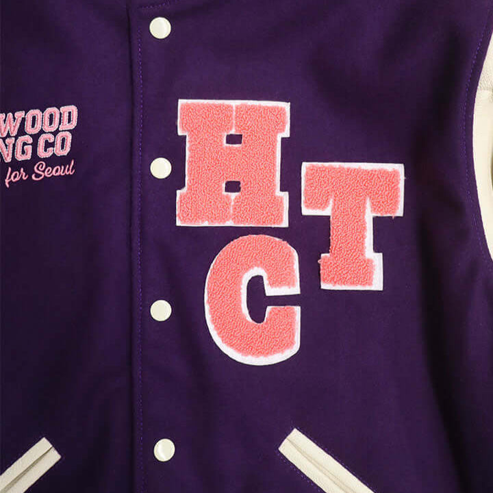 HTC LOS ANGELES HTC VARSITY JACKET PURPLE HTC VARSITY JACKET PURPLE Limited edition for Seoul. Varsity wool & leather bomber jacket. Front button closure, ribbed collar, cuffs and hem. Embroidered details and patches. Two side pockets. Main body compositi