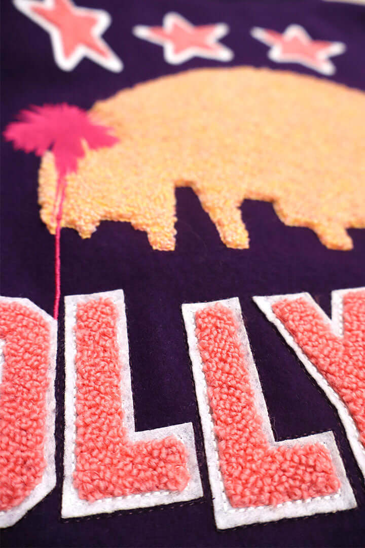 HTC LOS ANGELES HTC VARSITY JACKET PURPLE HTC VARSITY JACKET PURPLE Limited edition for Seoul. Varsity wool & leather bomber jacket. Front button closure, ribbed collar, cuffs and hem. Embroidered details and patches. Two side pockets. Main body compositi