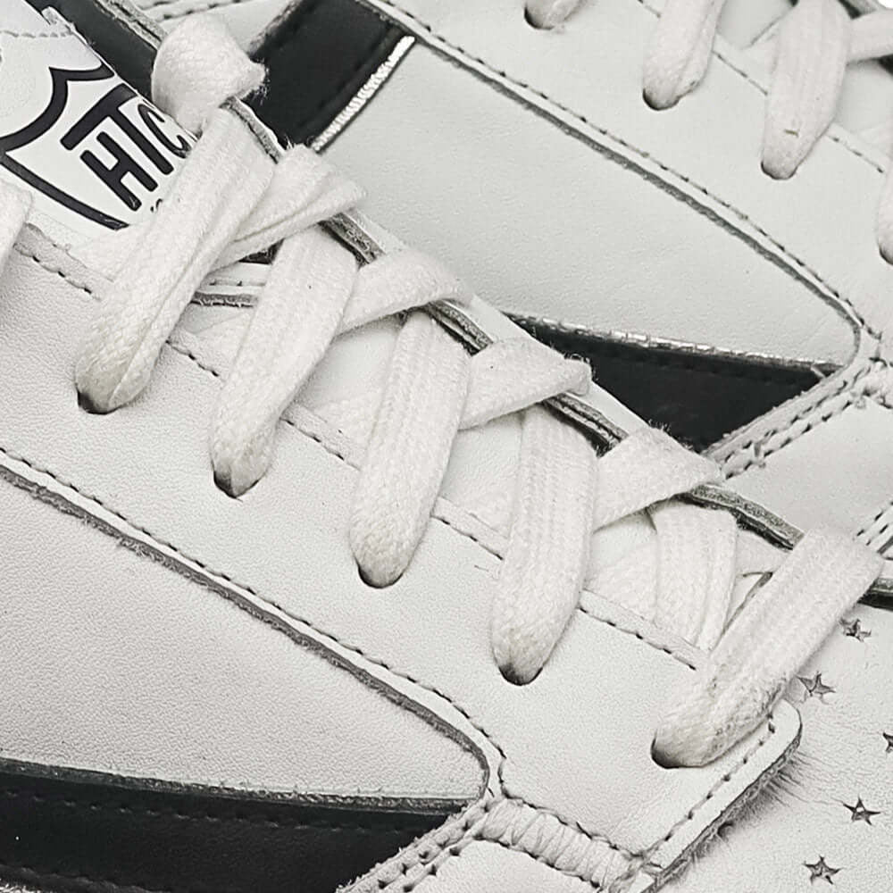 Hollywood Trading Company NEW STARLIGHT VINTAGE LOW WHITE/BLACK NEW STARLIGHT VINTAGE LOW WHITE/BLACK Starlight Low Vintage Sneakers, back pull loop with logo detail, rubber sole, perforated toe and front lace-up closure, 100% leather SHOES Hollywood Trad