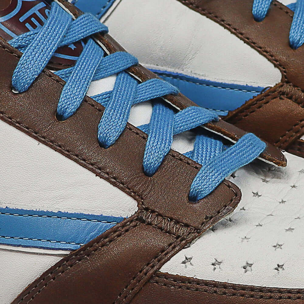 Hollywood Trading Company STARLIGHT COLOR SHIELD LOW MAN BROWN/BLUE STARLIGHT COLOR SHIELD LOW MAN BROWN/BLUE HTC Starlight Color Low Man sneakers, back pull loop with metal logo detail, front lace-up closure SHOES Hollywood Trading Company Hollywood Trad