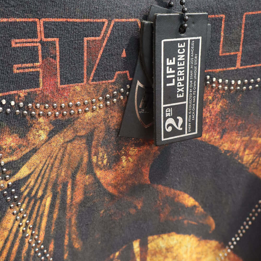 Hollywood Trading Company HTC VINTAGE METALLICA LUX T-SHIRT HTC VINTAGE METALLICA LUX T-SHIRT ONE OF A KIND VINTAGE T-SHIRT WITH ORIGINAL METALLICA PRINT, REWORKED WITH SILVER STUDDED HTC LOGO ON THE FRONT. BOXY FIT. t-shirt Hollywood Trading Company Holl