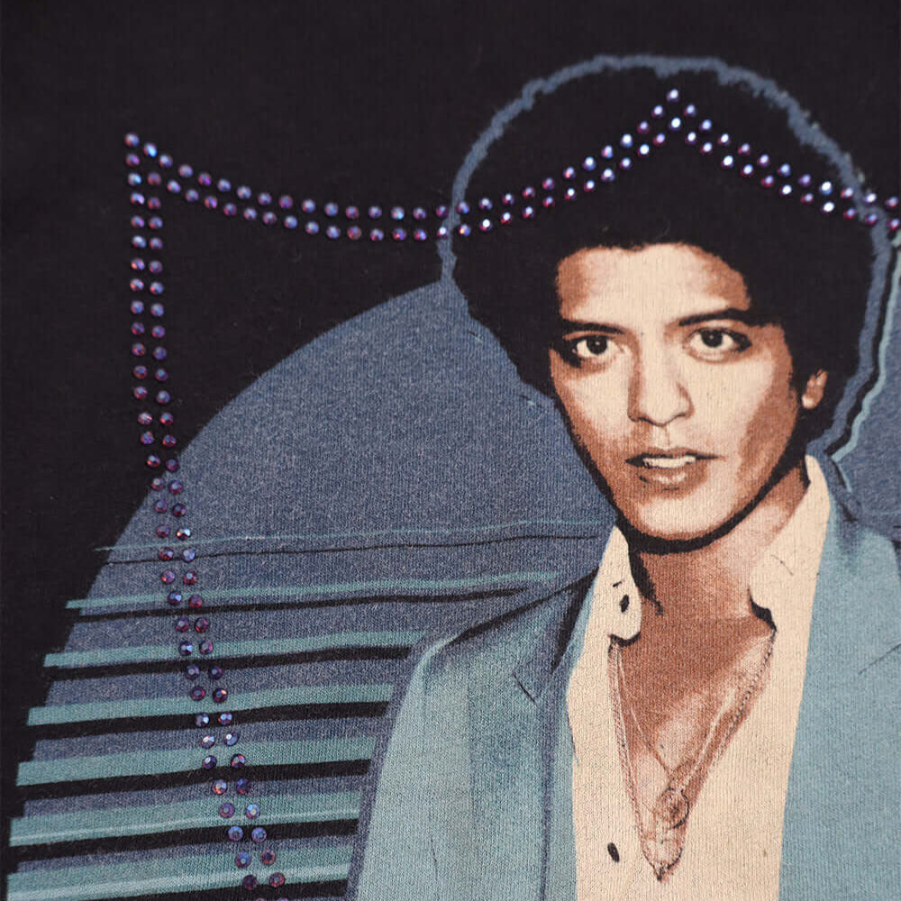 Hollywood Trading Company HTC VINTAGE BRUNO MARS LUX T-SHIRT HTC VINTAGE BRUNO MARS LUX T-SHIRT ONONE OF A KIND VINTAGE T-SHIRT WITH ORIGINAL BRUNO MARS PRINT, REWORKED WITH BLUE STUDDED HTC LOGO ON THE FRONT. SLIM FIT. t-shirt Hollywood Trading Company H