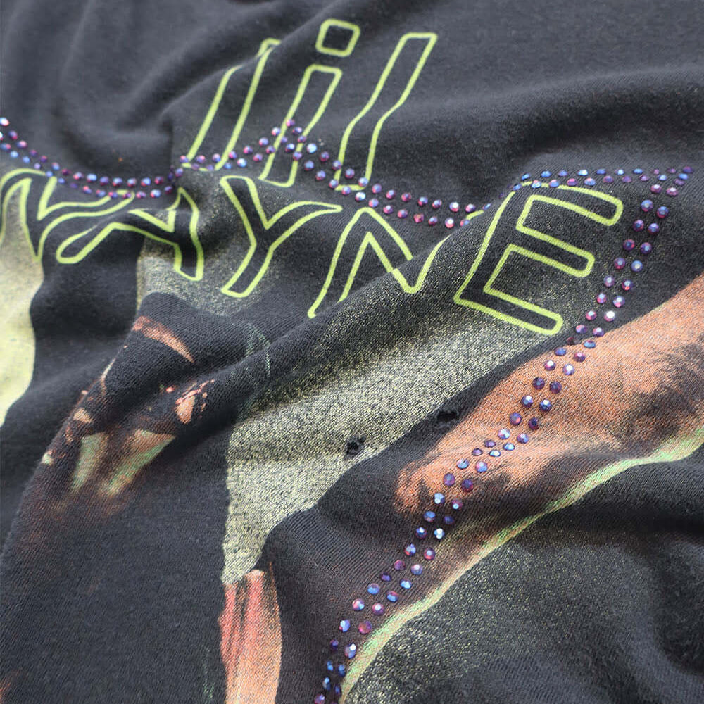Hollywood Trading Company HTC VINTAGE LIL WAYNE LUX T-SHIRT BLACK/GREEN HTC VINTAGE LIL WAYNE LUX T-SHIRT BLACK/GREEN ONE OF A KIND VINTAGE T-SHIRT WITH ORIGINAL LIL WAYNE PRINT, REWORKED WITH BLUE STUDDED HTC LOGO ON THE FRONT. REGULAR FIT. T-SHIRTS Holl