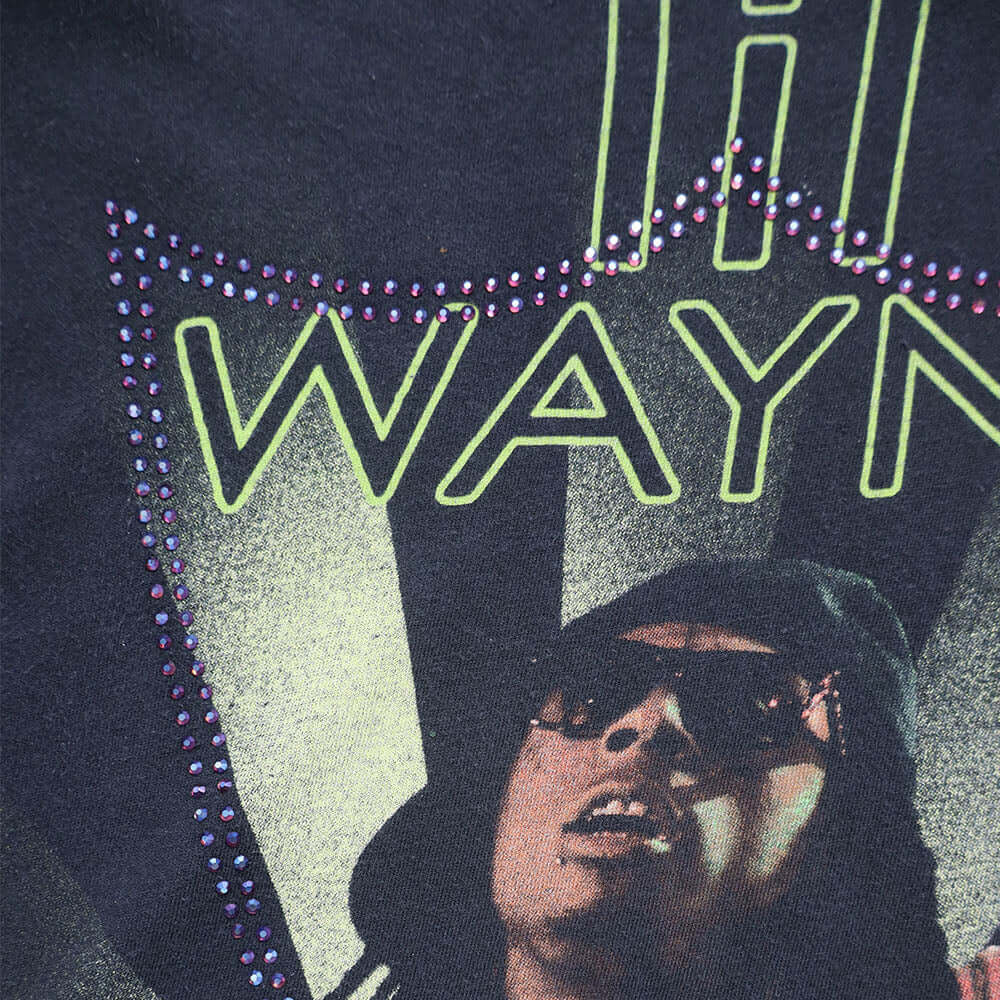 Hollywood Trading Company HTC VINTAGE LIL WAYNE LUX T-SHIRT BLACK/GREEN HTC VINTAGE LIL WAYNE LUX T-SHIRT BLACK/GREEN ONE OF A KIND VINTAGE T-SHIRT WITH ORIGINAL LIL WAYNE PRINT, REWORKED WITH BLUE STUDDED HTC LOGO ON THE FRONT. REGULAR FIT. T-SHIRTS Holl