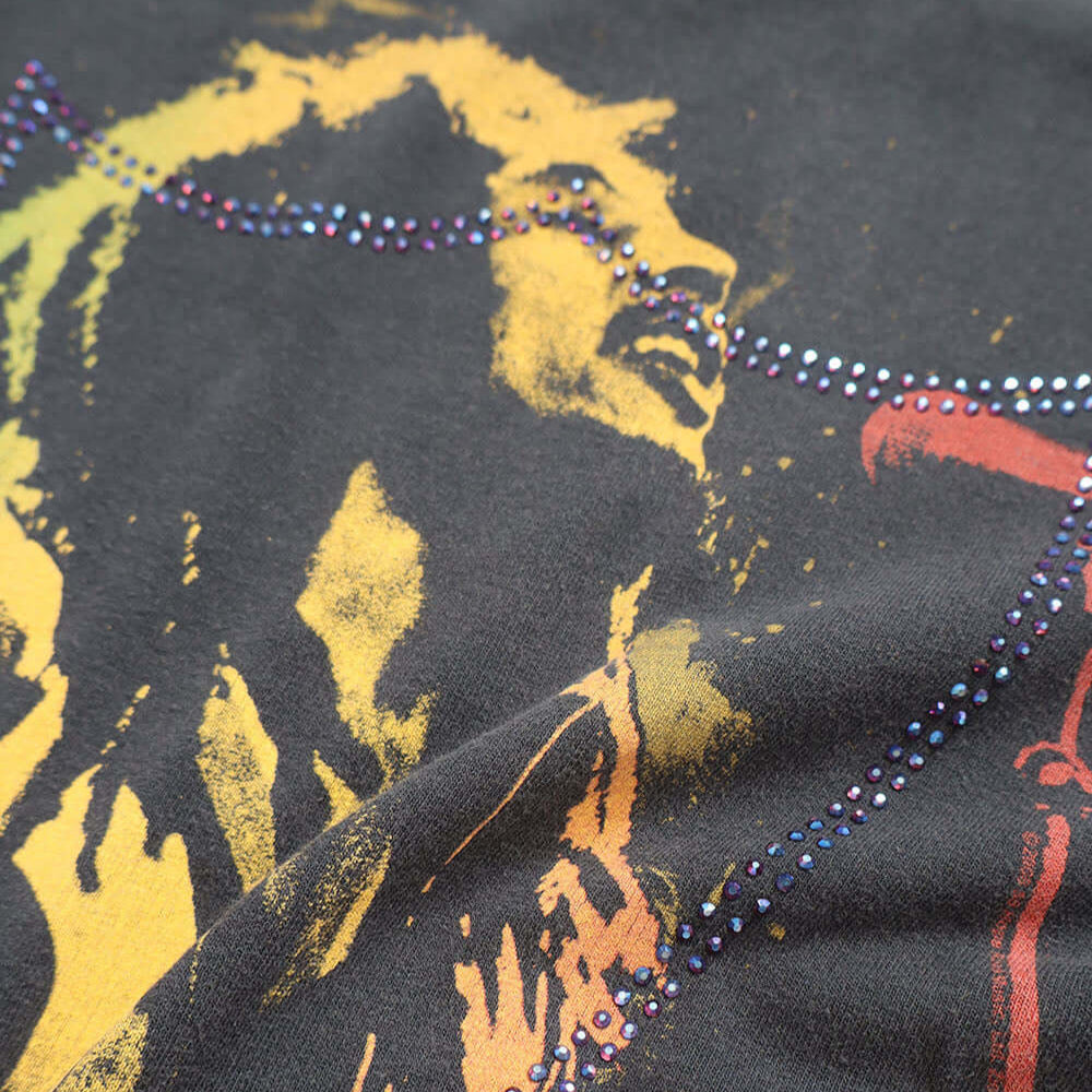 Hollywood Trading Company HTC VINTAGE BOB MARLEY LUX T-SHIRT MIX BLACK HTC VINTAGE BOB MARLEY LUX T-SHIRT MIX BLACK ONE OF A KIND VINTAGE T-SHIRT WITH ORIGINAL BOB MARLEY PRINT, REWORKED WITH BLUE STUDDED HTC LOGO ON THE FRONT. BOXY FIT. T-SHIRTS Hollywoo
