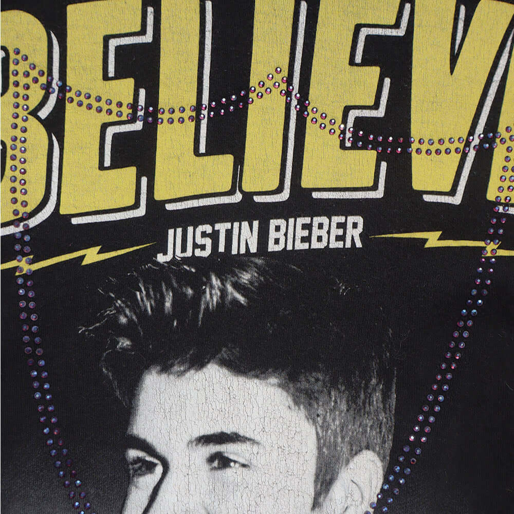 Hollywood Trading Company HTC VINTAGE JUSTIN BIEBER LUX T-SHIRT MIX BLACK HTC VINTAGE JUSTIN BIEBER LUX T-SHIRT MIX BLACK ONE OF A KIND VINTAGE T-SHIRT WITH ORIGINAL JUSTIN BIEBER PRINT, REWORKED WITH BLUE STUDDED HTC LOGO ON THE FRONT. REGULAR FIT. T-SHI