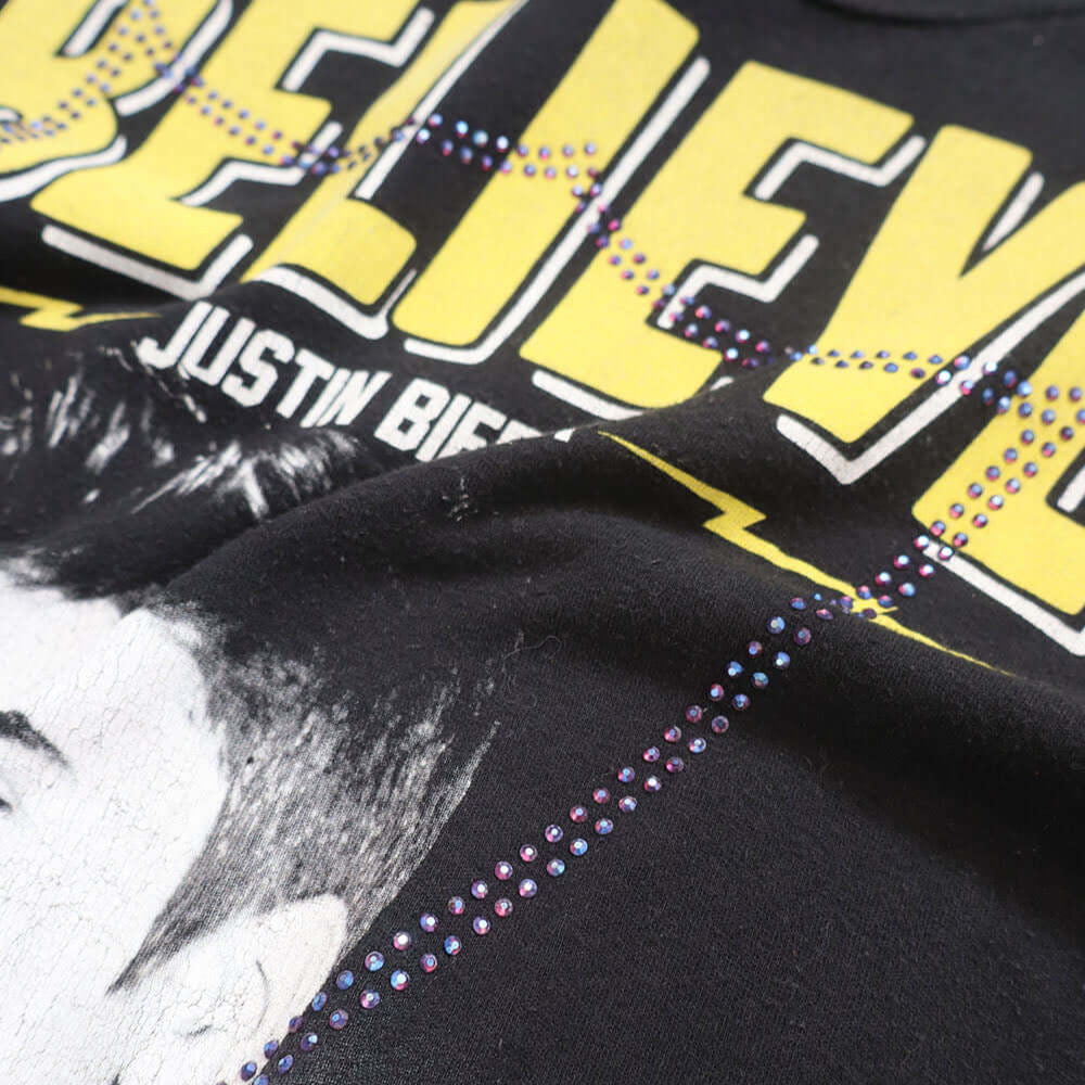 Hollywood Trading Company HTC VINTAGE JUSTIN BIEBER LUX T-SHIRT MIX BLACK HTC VINTAGE JUSTIN BIEBER LUX T-SHIRT MIX BLACK ONE OF A KIND VINTAGE T-SHIRT WITH ORIGINAL JUSTIN BIEBER PRINT, REWORKED WITH BLUE STUDDED HTC LOGO ON THE FRONT. REGULAR FIT. T-SHI