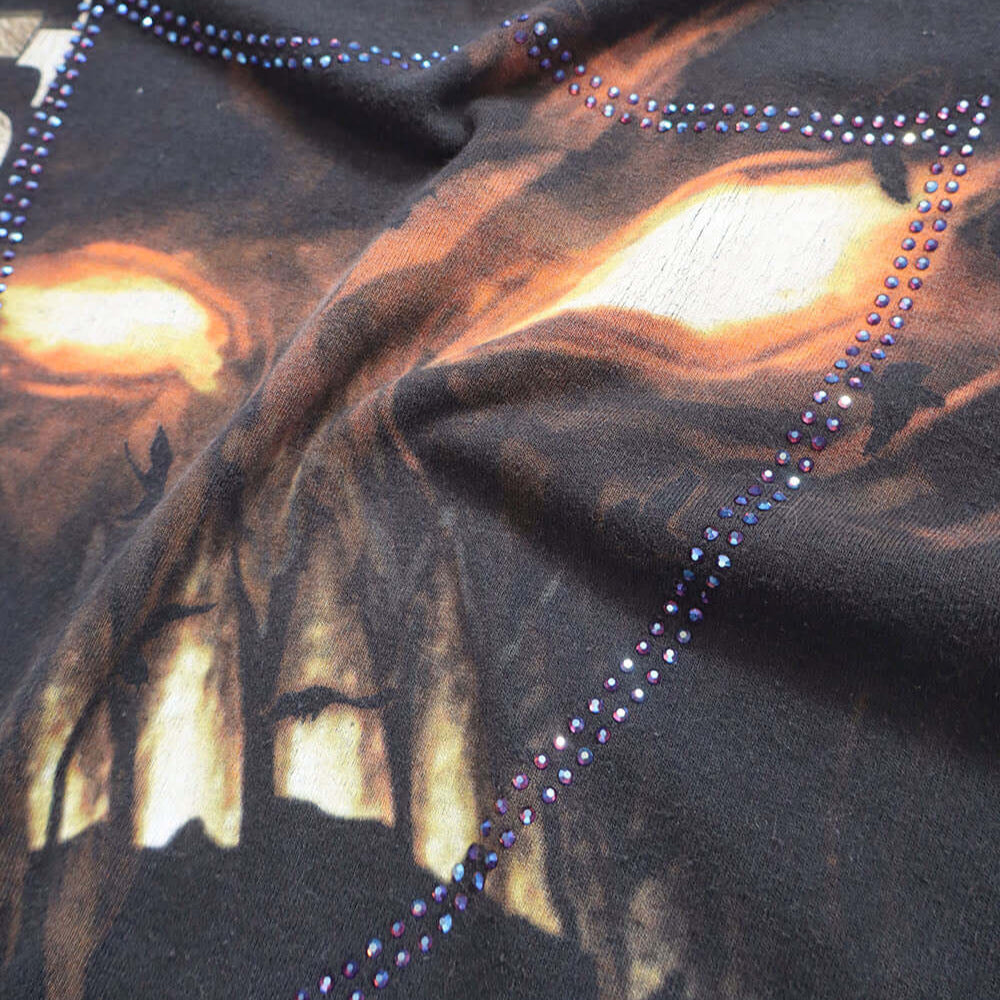 Hollywood Trading Company HTC VINTAGE DISTURBED LUX T-SHIRT MIX BLACK HTC VINTAGE DISTURBED LUX T-SHIRT MIX BLACK ONE OF A KIND VINTAGE T-SHIRT WITH ORIGINAL DISTURBED PRINT, REWORKED WITH BLUE STUDDED HTC LOGO ON THE FRONT. REGULAR FIT. T-SHIRTS Hollywoo