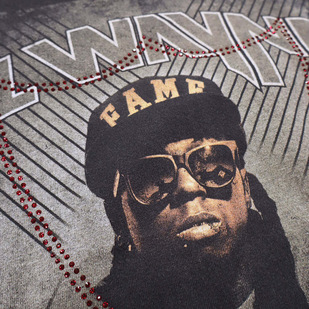 htc los angeles HTC VINTAGE LIL WAYNE STUDDED T-SHIRT MIX BLACK HTC VINTAGE LIL WAYNE STUDDED T-SHIRT MIX BLACK ONE OF A KIND VINTAGE T-SHIRT WITH ORIGINAL LIL WAYNE PRINT, REWORKED WITH RED STUDDED HTC LOGO ON THE FRONT. REGULAR FIT. T-SHIRTS Hollywood T