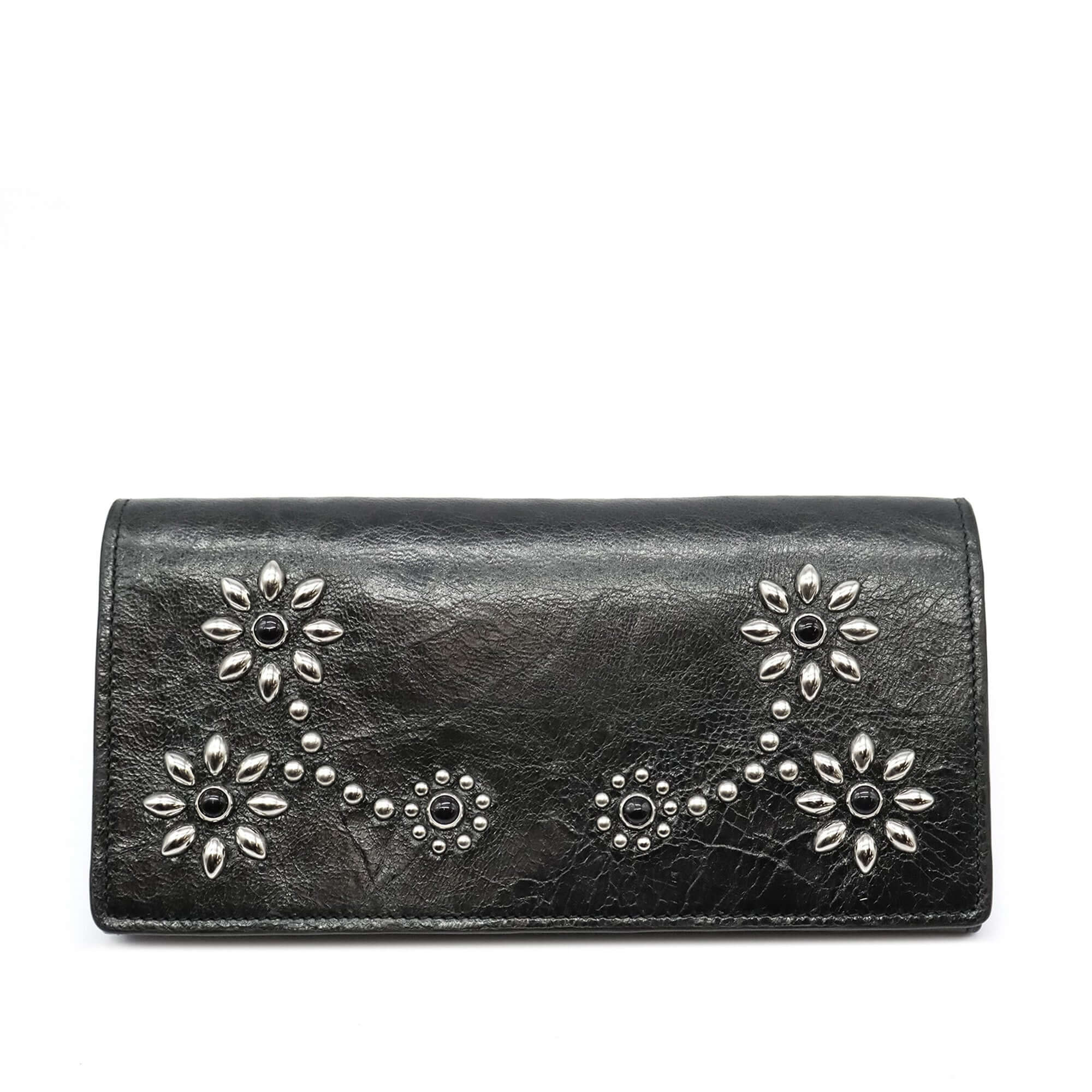 htc los angeles NANCY LONG WALLET BLACK Long wallet in Black, featuring a button closure. Designed with compartments for cards and coins, with flower studded details on the exterior. Crafted in Italy, 100% cow leather. Hollywood Trading Company