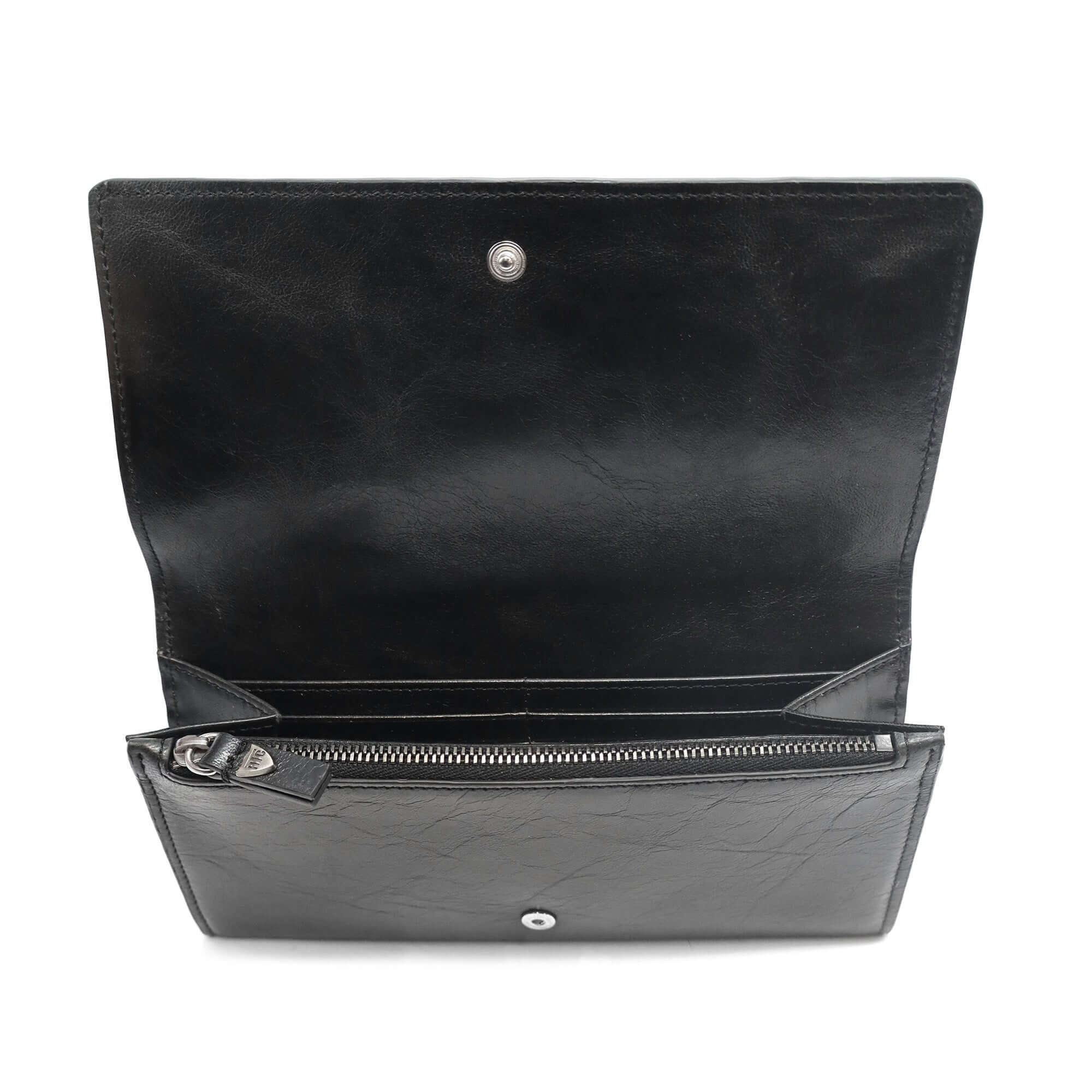 htc los angeles NANCY LONG WALLET BLACK Long wallet in Black, featuring a button closure. Designed with compartments for cards and coins, with flower studded details on the exterior. Crafted in Italy, 100% cow leather. Hollywood Trading Company
