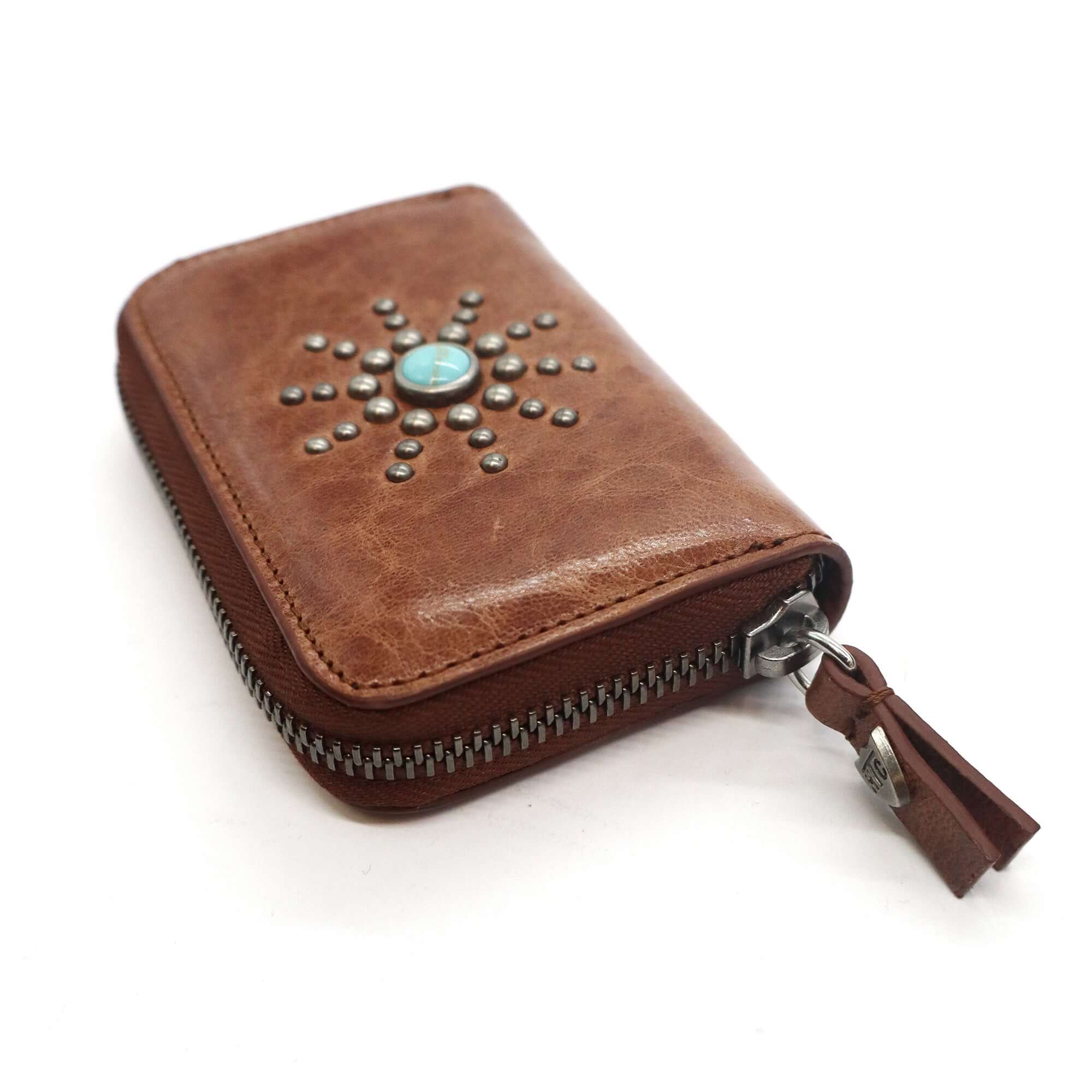 htc los angeles CLASSIC HTC SMALL ZIP WALLET COGNAC Small zip wallet in Cognac, designed with multiple compartments for cards, documents, and coins, adorned with stud details on the exterior. Crafted in Italy, 100% cow leather. Hollywood Trading Company