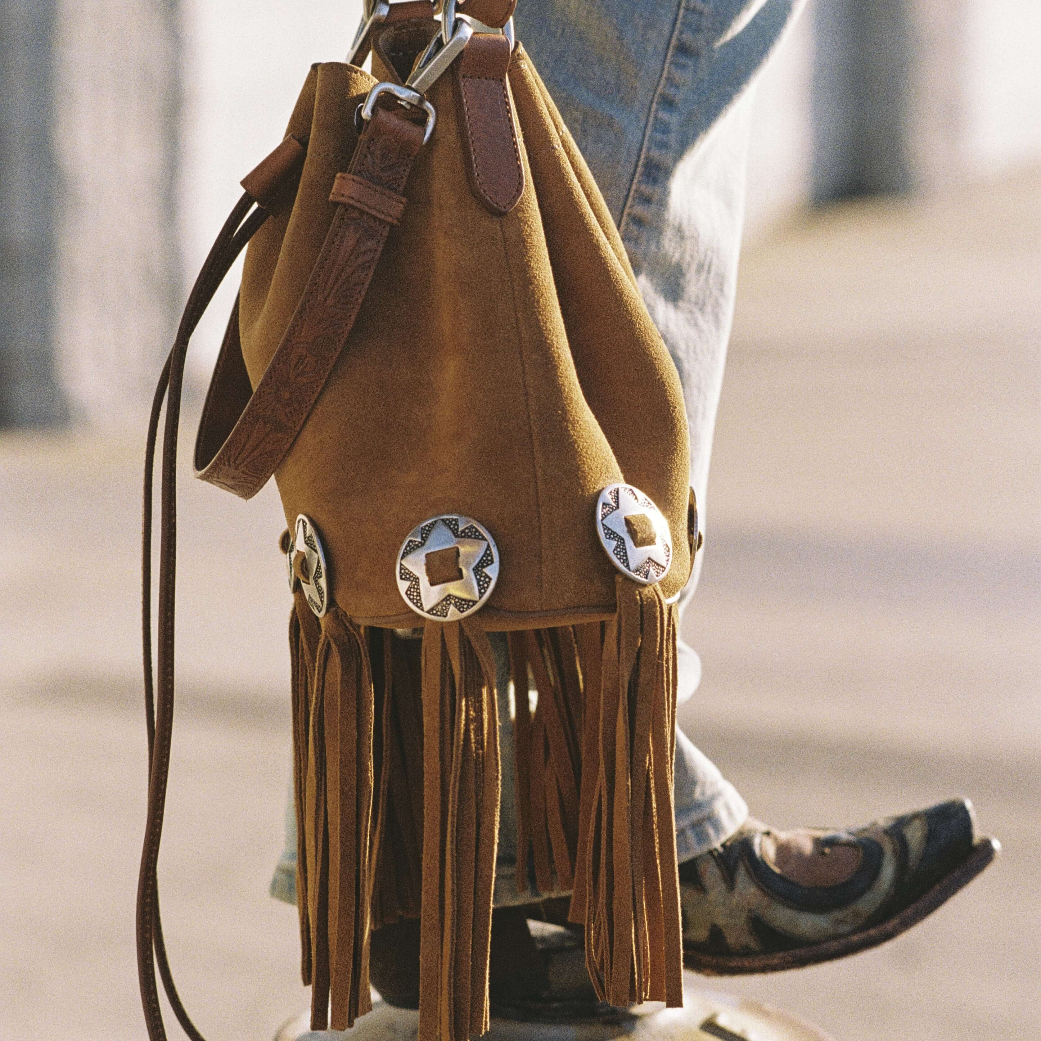 htc los angeles JANIS CONCHOS Bucket bag in Tan suede, featuring conchos and fringe details.Crafted in Italy, 100% cow leather. Hollywood Trading Company