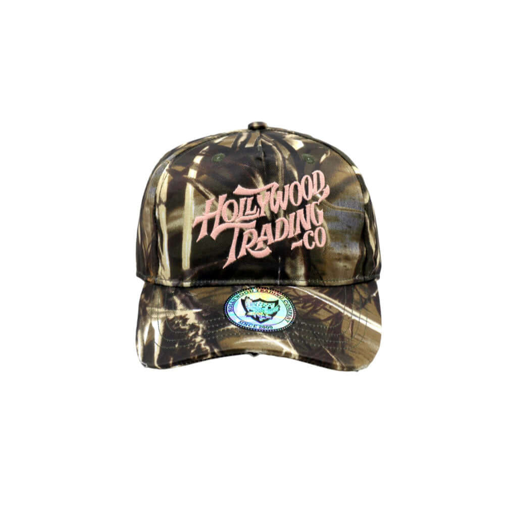Hollywood Trading Company HOLLYWOOD T.C. CAMO CAP HOLLYWOOD T.C. CAMO CAP Baseball cap with preformed peak, round crown with eyelets, Hollywood TC embroidered on the front, adjustable strap on the back. One size fits all. 100% cotton. Hollywood Trading Co