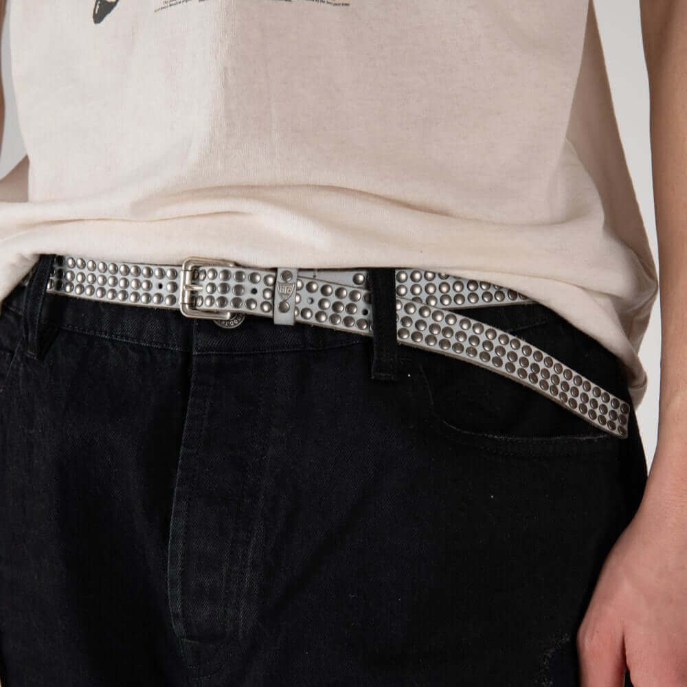 Hollywood Trading Company 3.000 STUDS COLOR BELT 3.000 STUDS COLOR BELT Leather belt with mixed studs, brass buckle, studded zamac belt loop with HTC logo rivet. Height: 2 cm. Made in Italy. BELTS Hollywood Trading Company Hollywood Trading Company