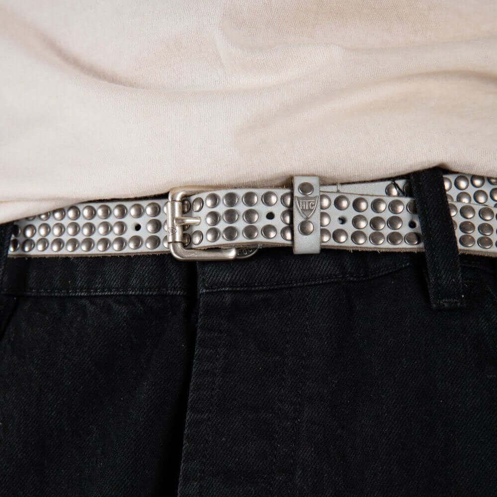 Hollywood Trading Company 3.000 STUDS COLOR BELT 3.000 STUDS COLOR BELT Leather belt with mixed studs, brass buckle, studded zamac belt loop with HTC logo rivet. Height: 2 cm. Made in Italy. BELTS Hollywood Trading Company Hollywood Trading Company
