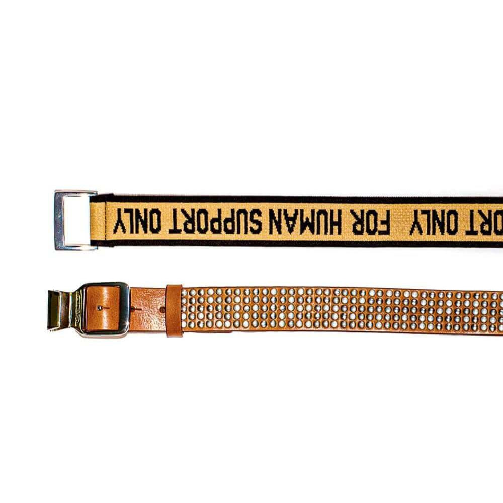 Hollywood Trading Company 5.000 FASTEN BELT 5.000 FASTEN BELT Studded leather belt & elastic band. Tension buckle closure. Height: 3,5 cm. Composition: 50% Leather 50% Polyester. Made in Italy BELTS Hollywood Trading Company Hollywood Trading Company