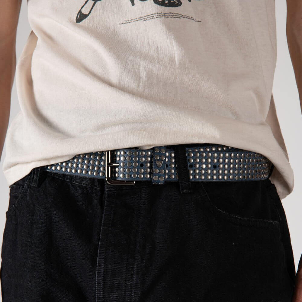 Hollywood Trading Company 5.000 STUDS COLOR BELT 5.000 STUDS COLOR BELT Leather belt with mixed studs, brass buckle, studded zamac belt loop with HTC logo rivet. Height: 3.5 cm. Made in Italy. BELTS Hollywood Trading Company Hollywood Trading Company