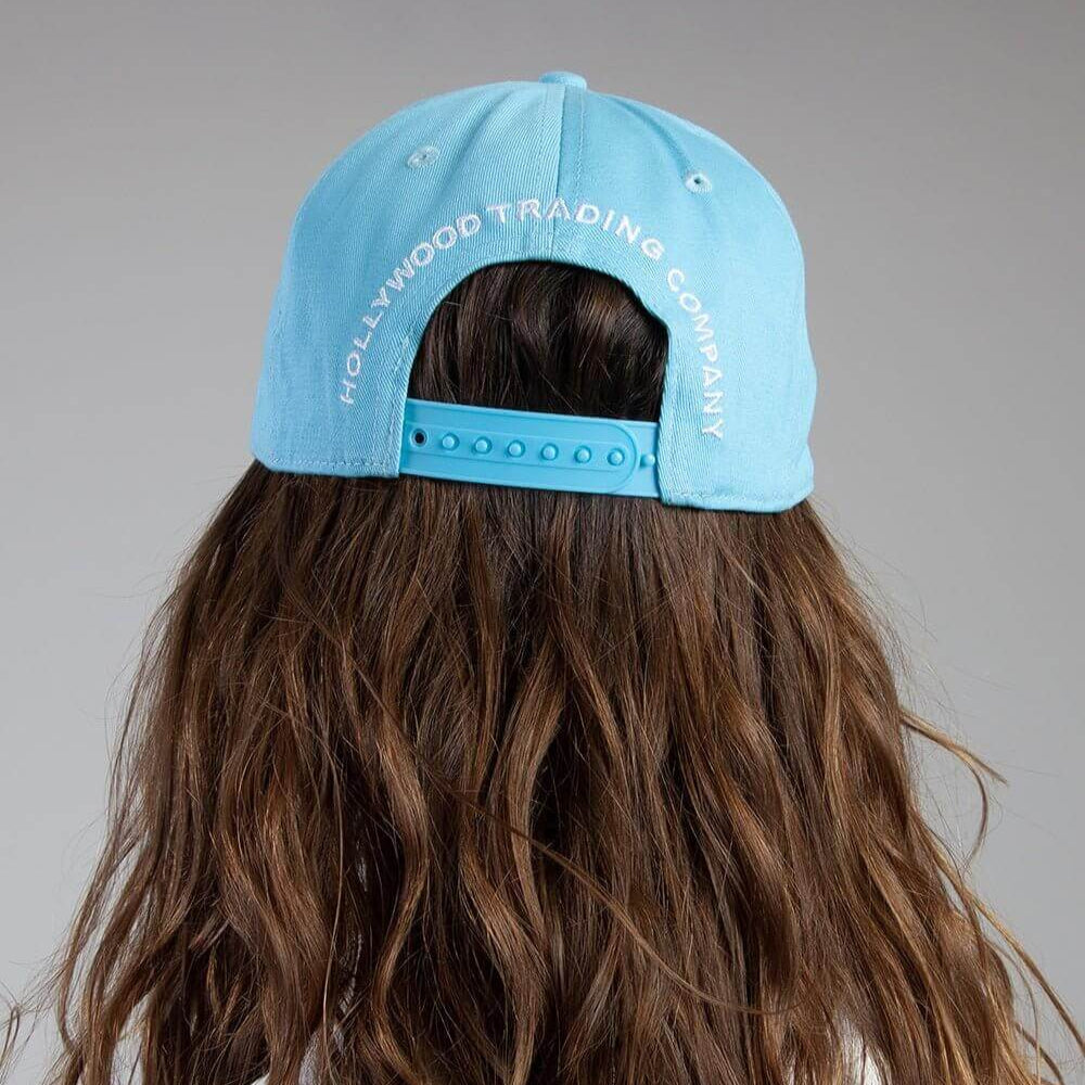 HTC LOS ANGELES ATTITUDE CAP LIGHT BLUE ATTITUDE CAP LIGHT BLUE Blue baseball cap , round crown with eyelets , Attitude logo embroidered on the front, adjustable strap on the back. One size fits all. 100% cotton. HATS Hollywood Trading Company Hollywood T