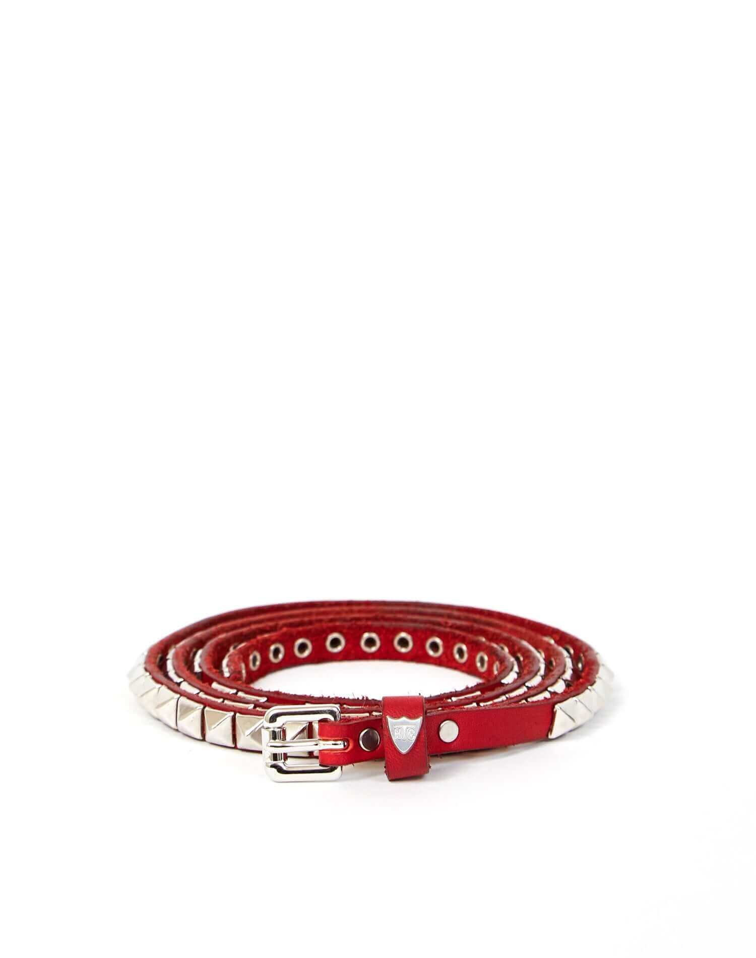 CHELSIE BELT Red leather belt with pyramidal studs, buckle and belt loop in shiny metal. Height: 1 cm. Made in Italy. HTC LOS ANGELES