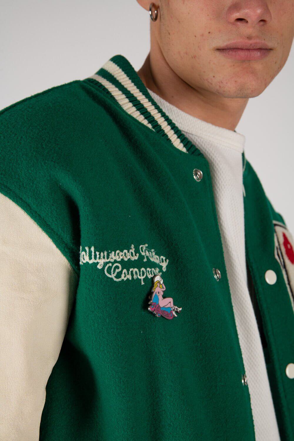 COLLEGE - CARDS Varsity wool & leather bomber jacket. Front button closure, ribbed collar, cuffs and hem. Embroidered details and patches. Two side pockets. Main body composition: 70% Wool, 30% Acrylic; sleeves: 100% Leather HTC LOS ANGELES
