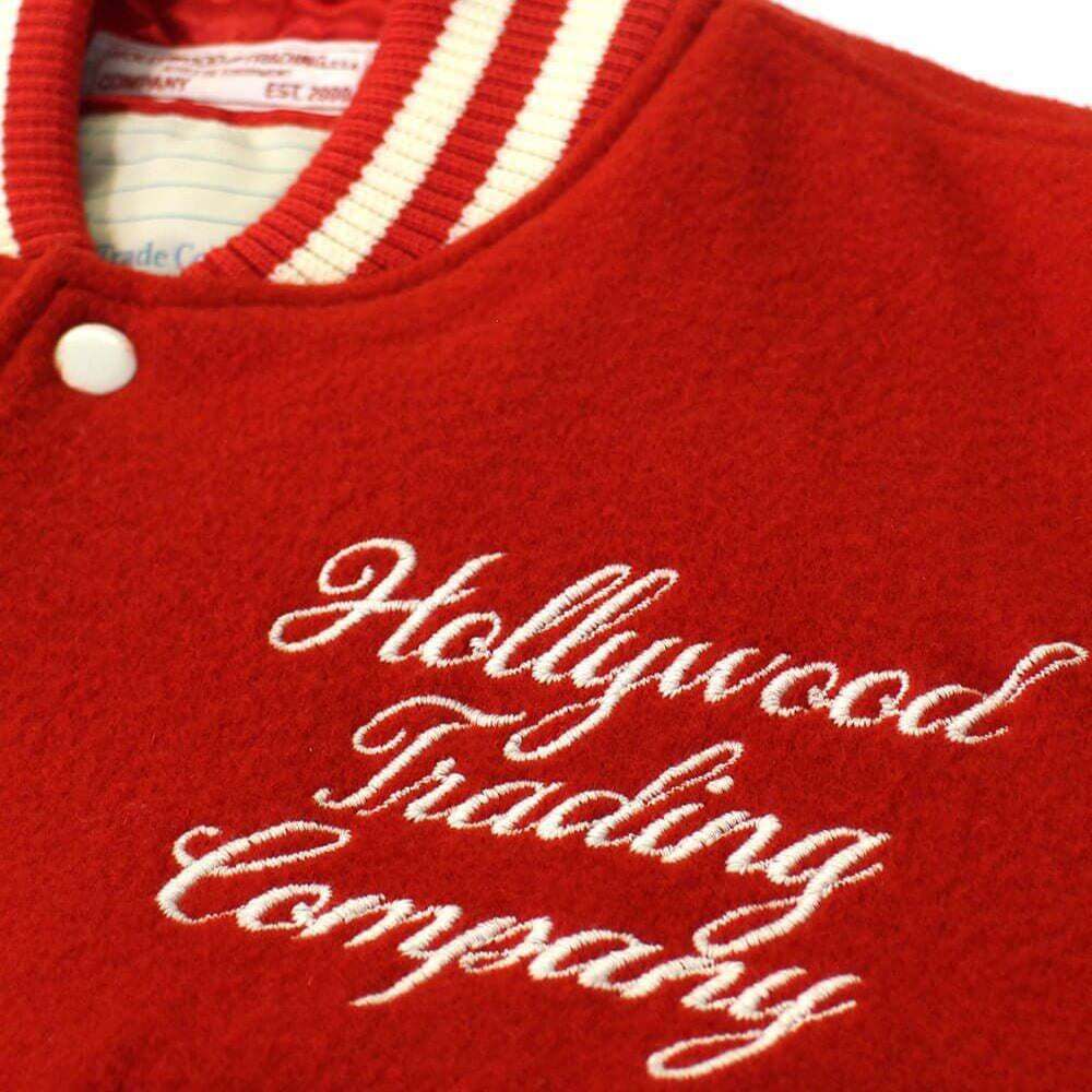 Hollywood Trading Company COLLEGE - EMBROIDERY WOMAN COLLEGE - EMBROIDERY WOMAN Varsity wool & leather bomber jacket. Front button closure, ribbed collar, cuffs and hem. Embroidered details. Two side pockets. Main body composition: 70% Wool, 30% Acrylic;