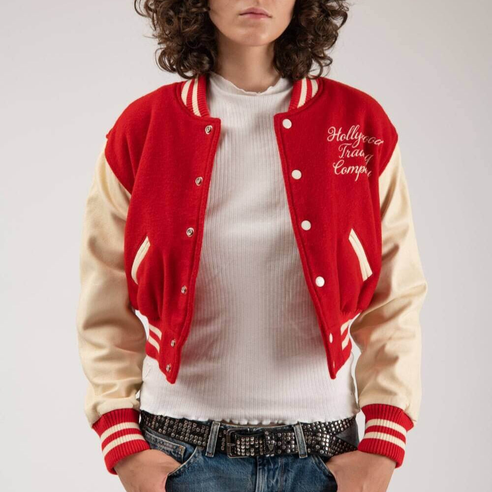 Hollywood Trading Company COLLEGE - EMBROIDERY WOMAN COLLEGE - EMBROIDERY WOMAN Varsity wool & leather bomber jacket. Front button closure, ribbed collar, cuffs and hem. Embroidered details. Two side pockets. Main body composition: 70% Wool, 30% Acrylic;