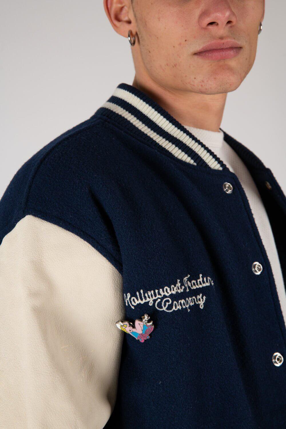 COLLEGE - H Varsity wool & leather bomber jacket. Front button closure, ribbed collar, cuffs and hem. Embroidered details and patches. Two side pockets. Main body composition: 70% Wool, 30% Acrylic; sleeves: 100% Leather HTC LOS ANGELES