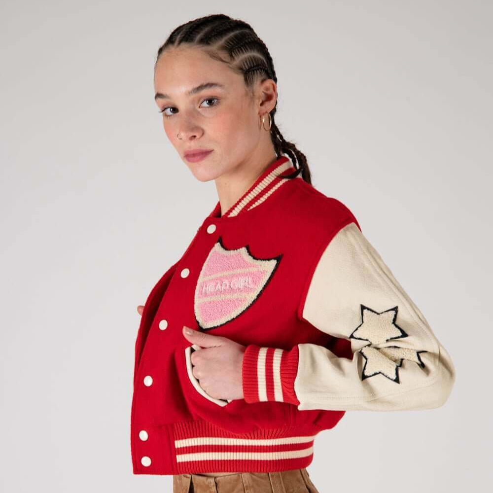 Hollywood Trading Company COLLEGE - SHIELD COLLEGE - SHIELD Varsity wool & leather bomber jacket. Front button closure, ribbed collar, cuffs and hem. Embroidered details and patches. Two side pockets. Main body composition: 70% Wool, 30% Acrylic; sleeves: