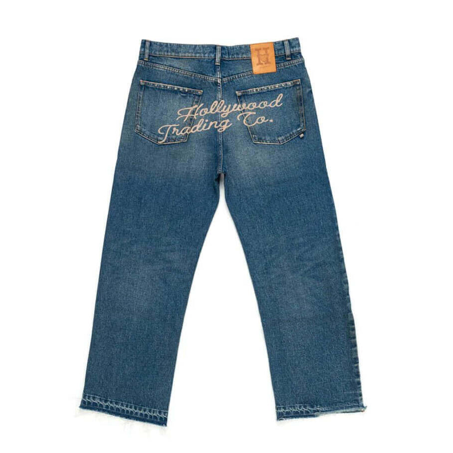 htclosangeles GATORADE - HOLLYWOOD GATORADE - HOLLYWOOD Loose fit jeans with front button and zip closure. Back embroidered logo and leather logo patch. Composition: 100% Cotton Hollywood Trading Company Hollywood Trading Company