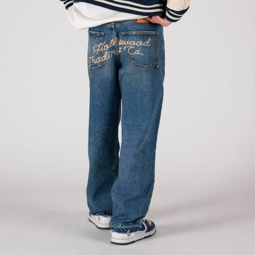 htclosangeles GATORADE - HOLLYWOOD GATORADE - HOLLYWOOD Loose fit jeans with front button and zip closure. Back embroidered logo and leather logo patch. Composition: 100% Cotton Hollywood Trading Company Hollywood Trading Company