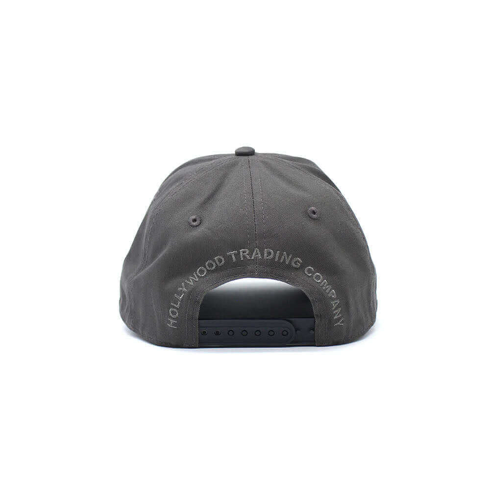 Hollywood Trading Company HOLLYWOOD T.C. CAP HOLLYWOOD T.C. CAP Grey baseball cap , round crown with eyelets , Hollywood T.C. logo embroidered on the front, adjustable strap on the back. One size fits all. 100% cotton. cap Hollywood Trading Company Hollyw