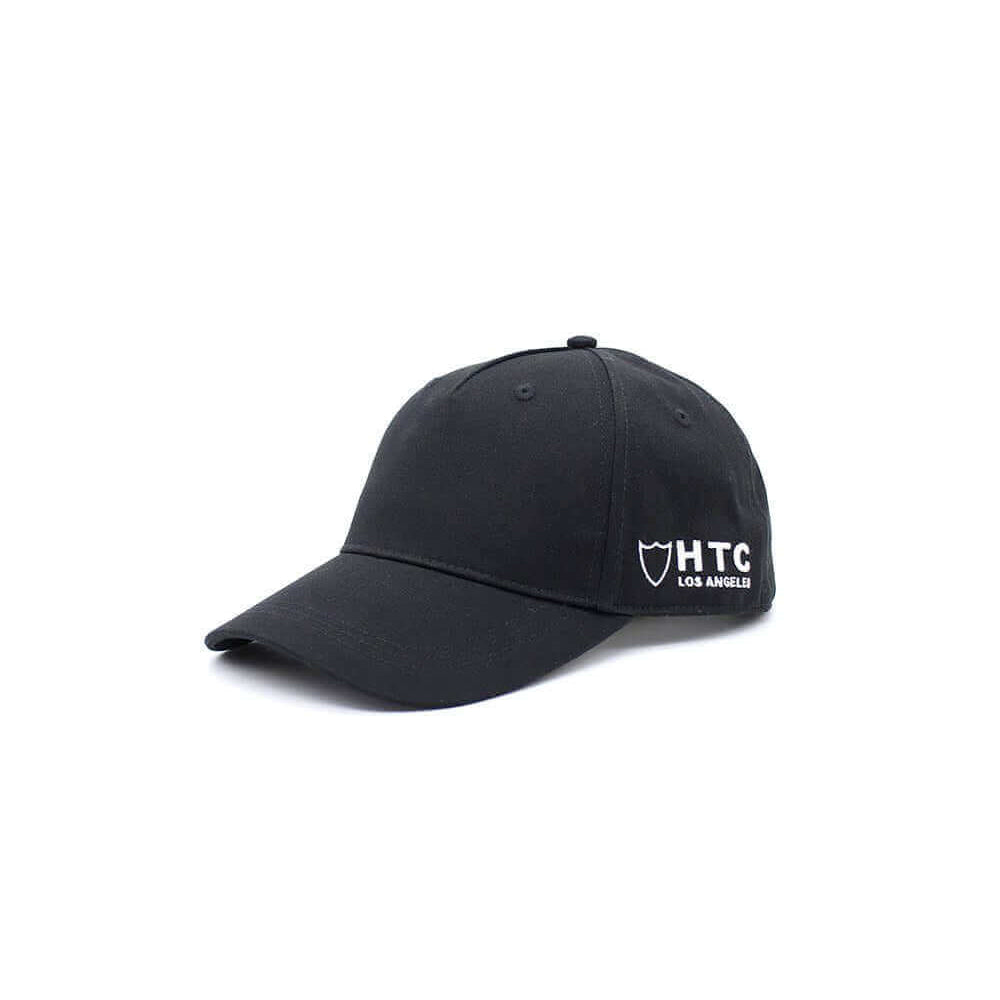 HTC LOS ANGELES HTC SIDE CAP HTC SIDE CAP Black baseball cap , round crown with eyelets , htc logo embroidered on the side, adjustable strap on the back. One size fits all. 100% cotton. cap Hollywood Trading Company Hollywood Trading Company