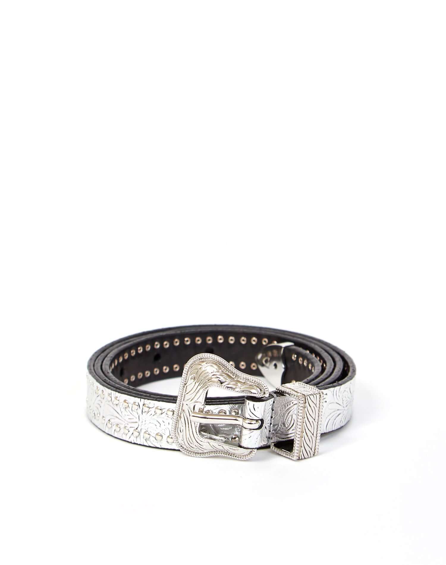 JOANA MINI BELT Silver leather belt with studs on the outline and carved details, buckle and belt loop in shiny metal. Height: 2 cm. Made in Italy. HTC LOS ANGELES