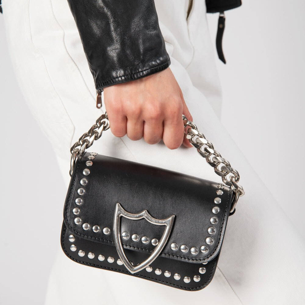Hollywood Trading Company L.A. STUDS MICRO BAG L.A. STUDS MICRO BAG Leather micro bag. Front studded flap with snap button closure. Front silver colored metal logo detail. One internal patch pocket. Leather lining. Shoulder leather strap and metal chain l