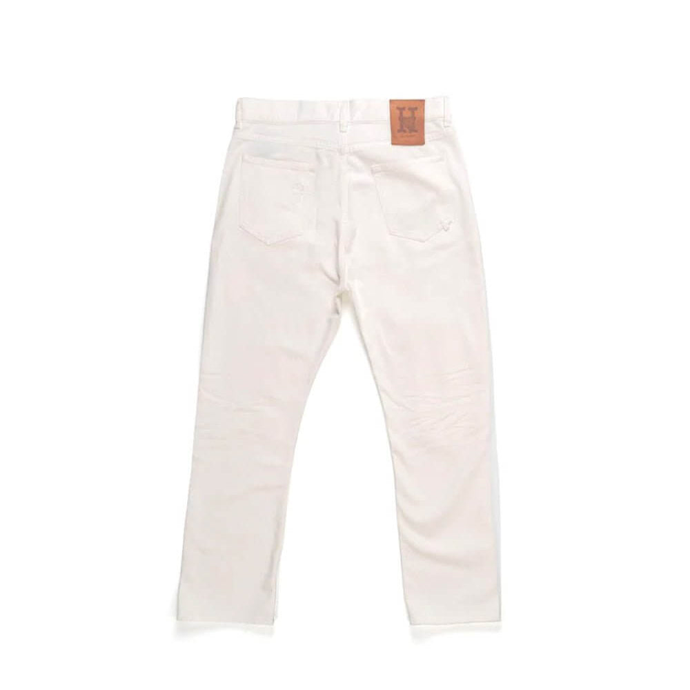 Hollywood Trading Company LOOSE LOOSE Loose fit jeans with front button and zip closure. Back leather logo patch. Intentionally distressed areas may vary. Five pockets. Hem: 17 cm. Composition: 100% Cotton PANTS Hollywood Trading Company Hollywood Trading