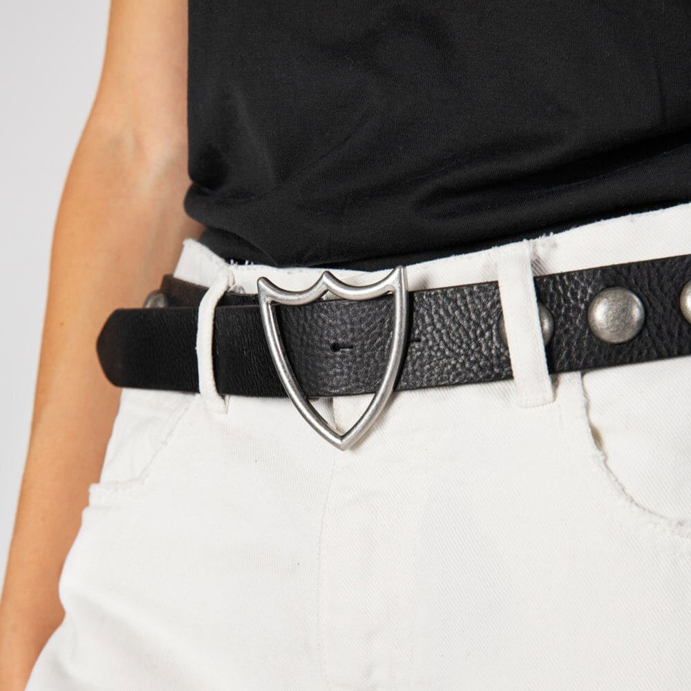 Hollywood Trading Company SHIELD STUDDED BELT SHIELD STUDDED BELT Black leather belt with studs. Shield shaped buckle. 3,5 cm height. BELTS Hollywood Trading Company Hollywood Trading Company