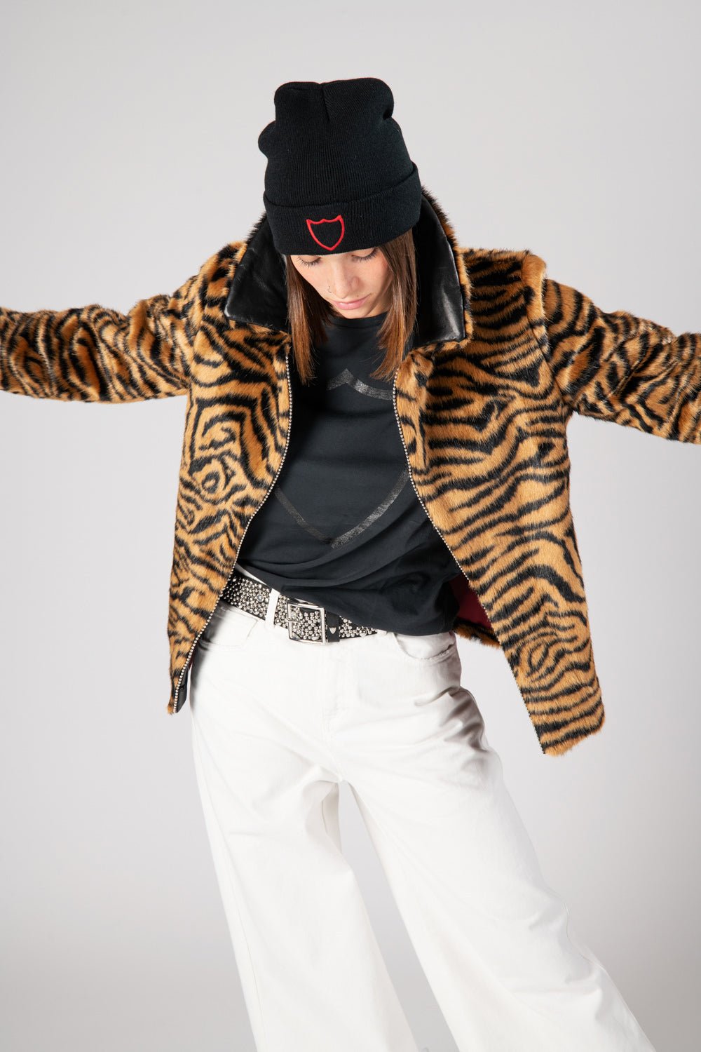 TIGER FAUX FUR BLAZER Tiger faux fur bazer, leather collar with hand-studded edge. Contrasting red lining. HTC LOS ANGELES